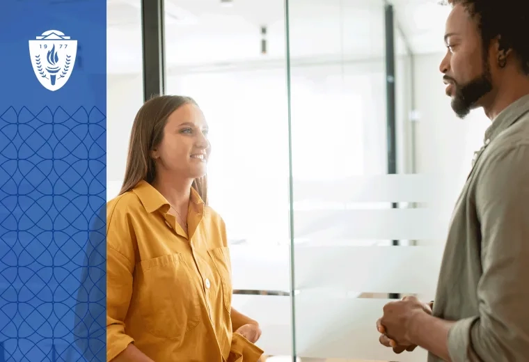 Woman wearing yellow shirt and man wearing green shirt standing in front of each other