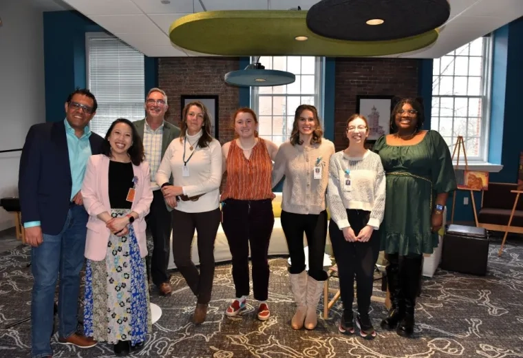 8 people standing together 