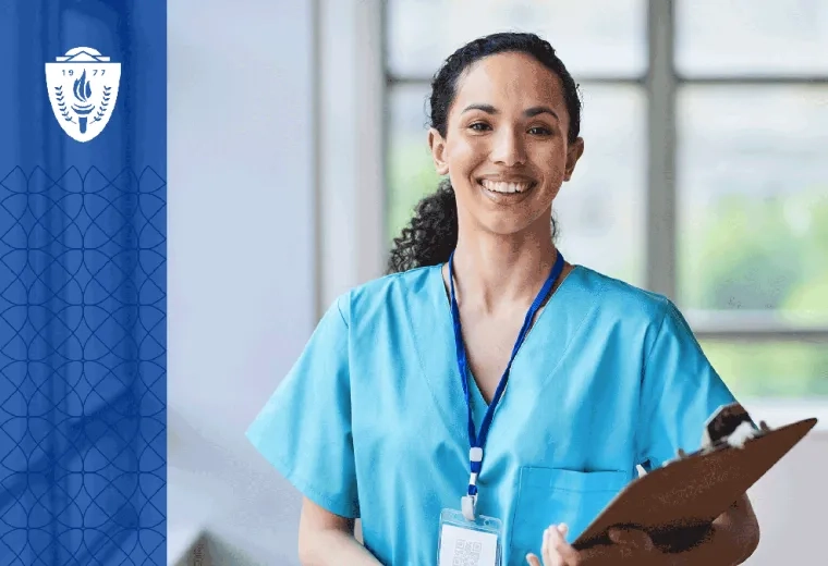Nurse holding a clipboard, wearing blue scrubs, and wearing a lanyard around her neck