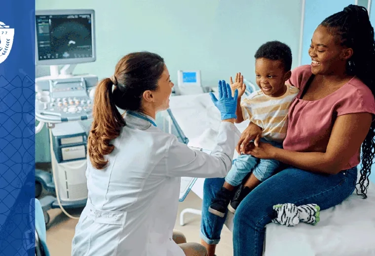 Mother and her child sitting in exam room while the nurse high fives the child