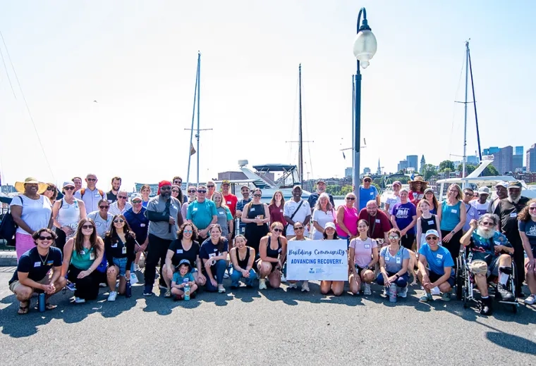 A group photo of stroke survivors, care partners, students, faculty, staff, and community partners after the Waterfront Wellness Walk