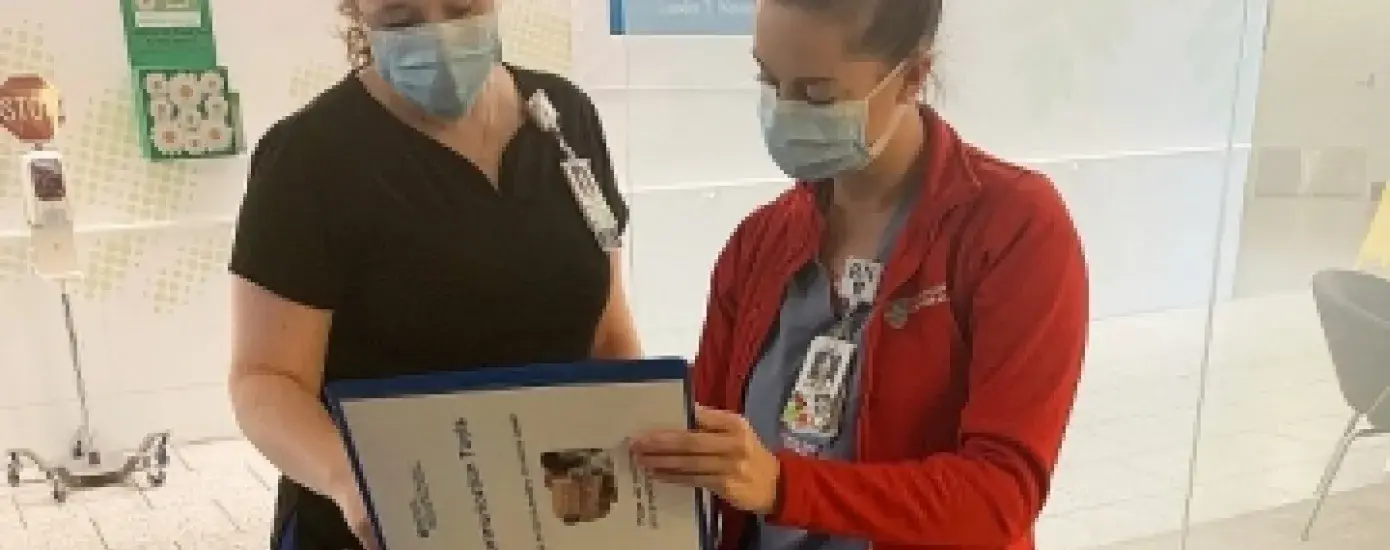 Sarah Gendreau, left, talks with her nursing colleague Katelyn Bushey at Mass. General.