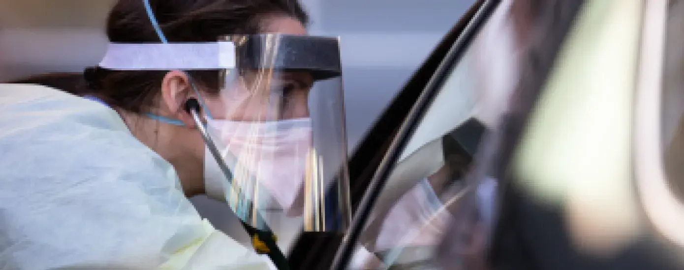 Shelby Lee Freed, MSN '11, working with a COVID-19 patient at Oregon Health & Sciences University Hospital. PHOTO: Bradley W. Parks. Courtesy of Oregon Public Broadcasting.