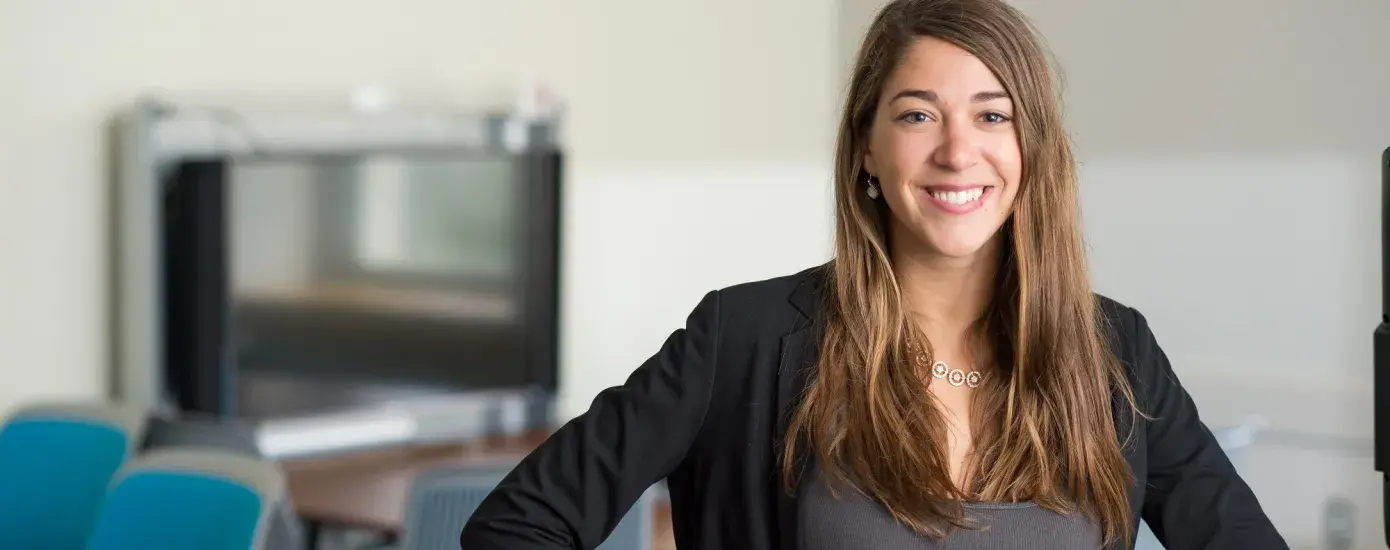 profile photo of sophie leaning on a desk