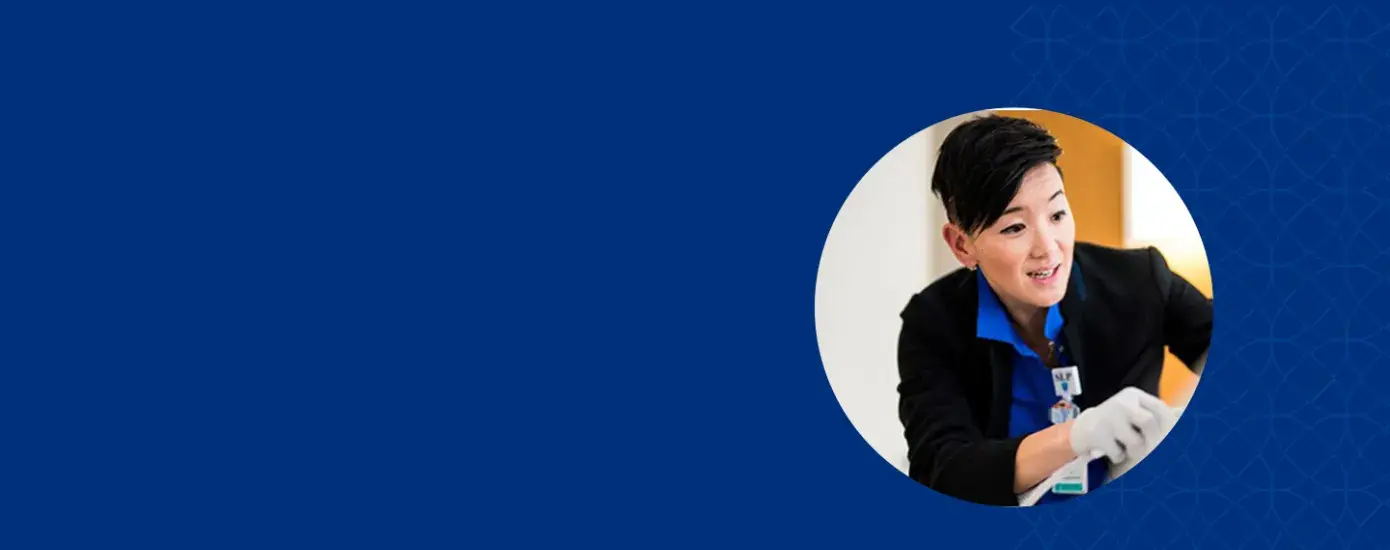 Amy wears rubber gloves and works with instruments