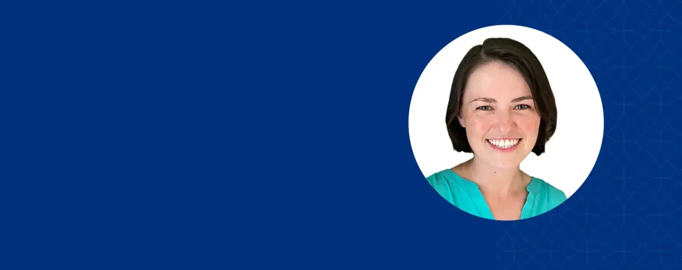 jenny has short dark hair and wears a teal top