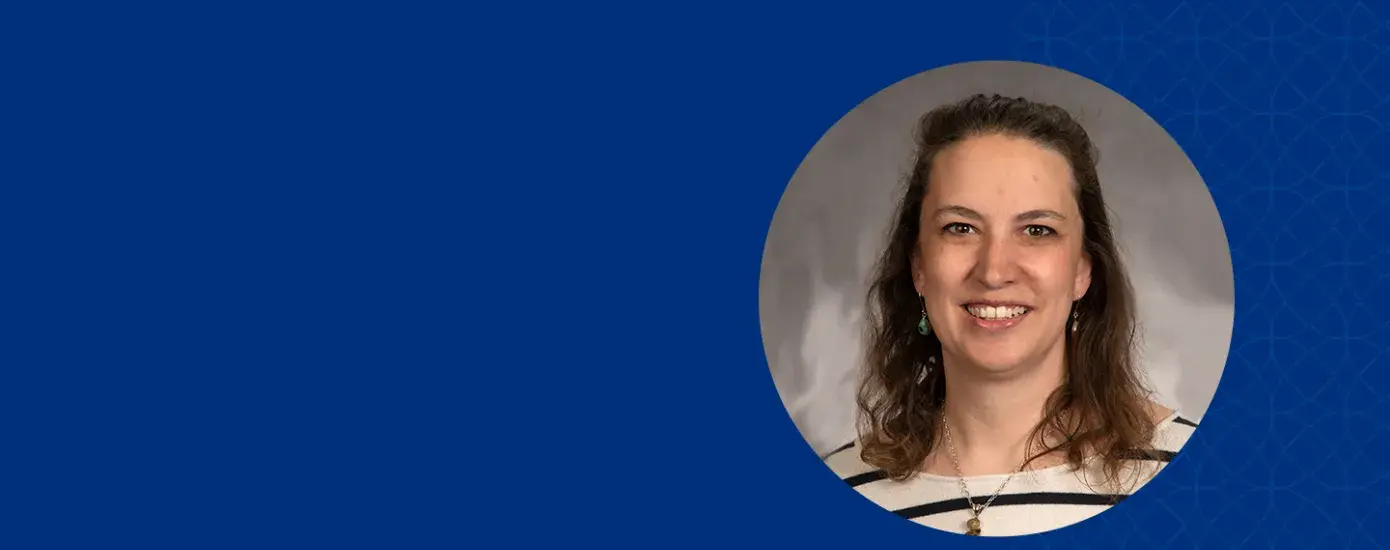 profile photo of catie she wears a black and white striped shirt