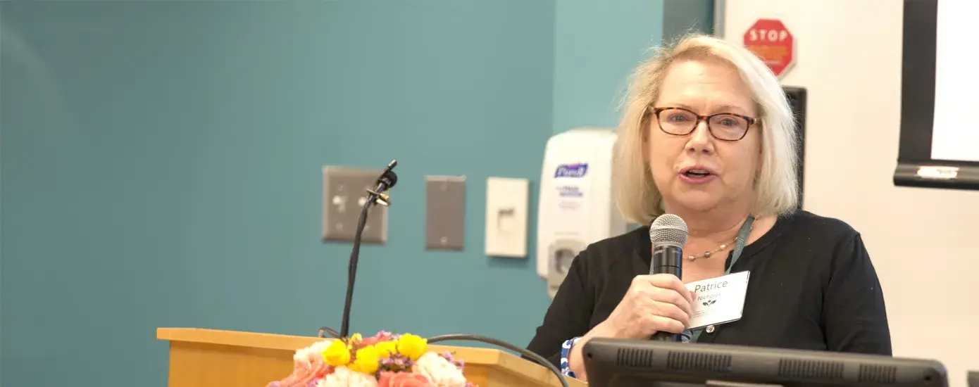 woman speaking at podium