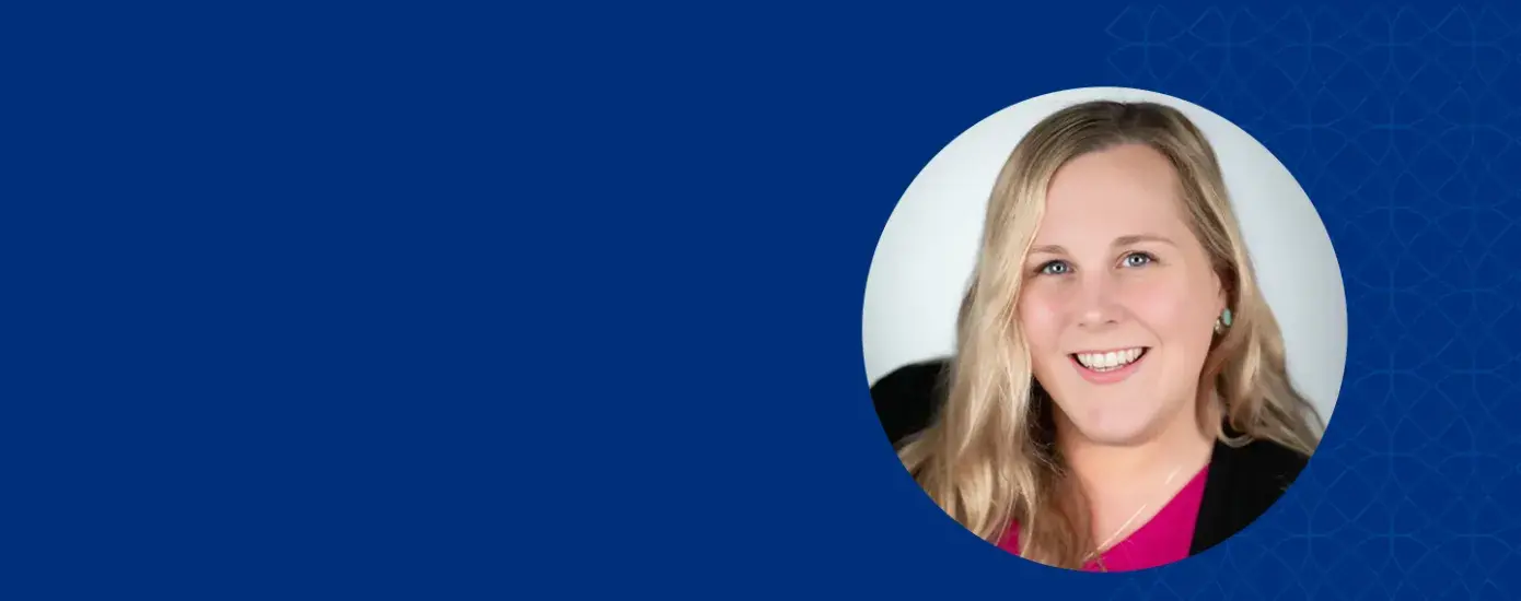 abby has wavy blonde hair and a pink shirt with a black blazer