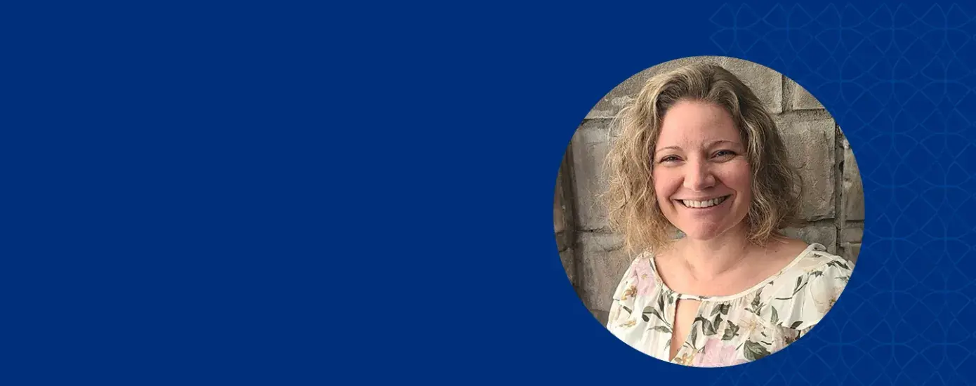 amy wears a flowered spring colored top