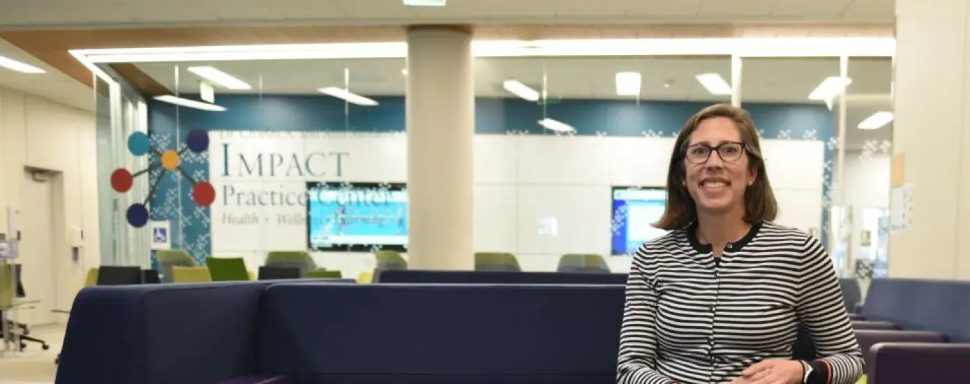 A woman sits on a couch