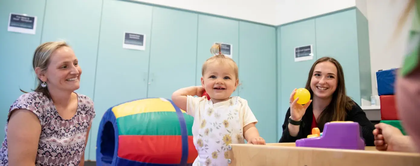 alumni mary odonnell and child in OT center 