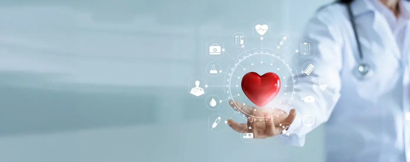 red heart floats above the hand of someone wearing a white lab coat