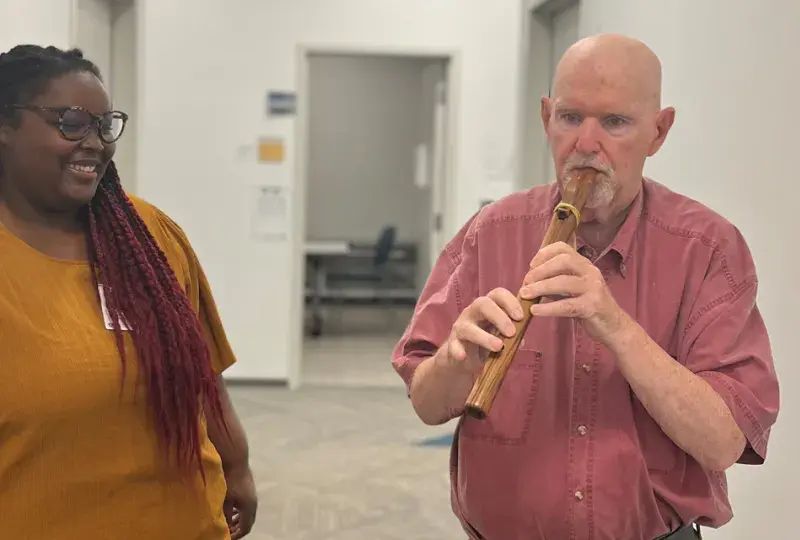 SLP student Simone Moss works with Aphasia Center client Leo Ross.