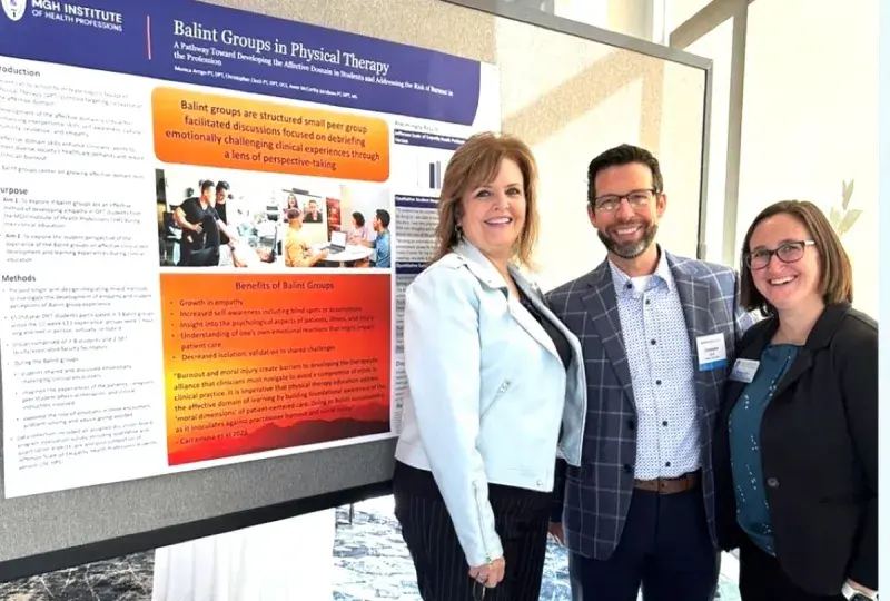 People in front of research poster