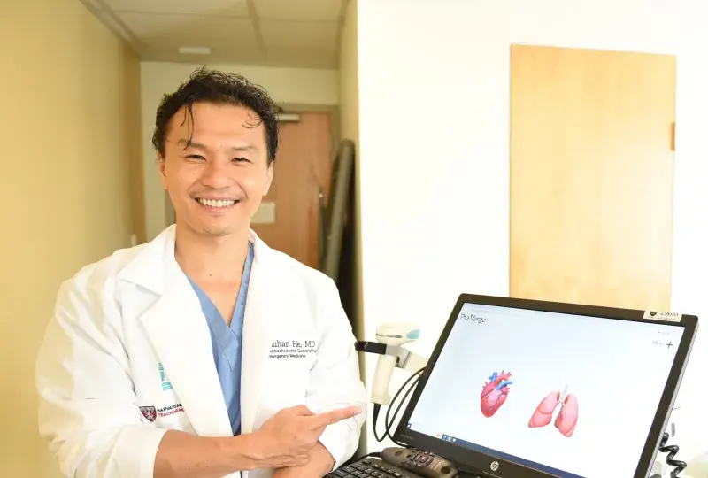 Man pointing at laptop