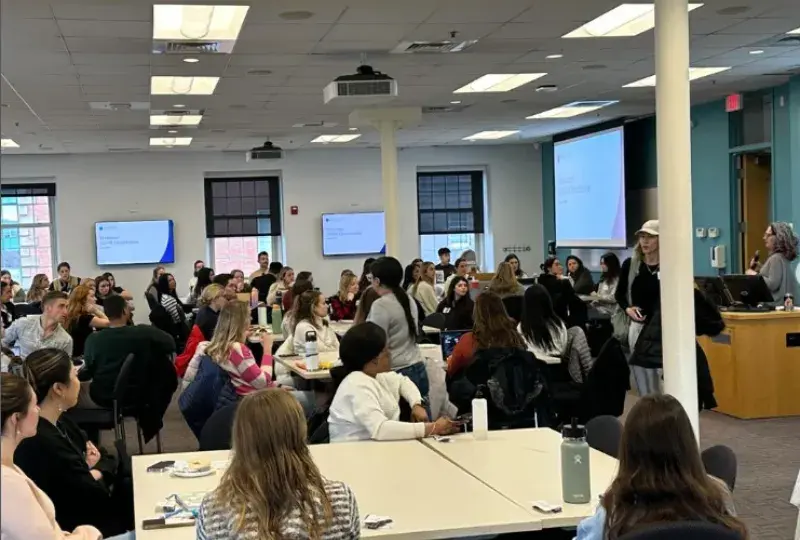 students sit in room