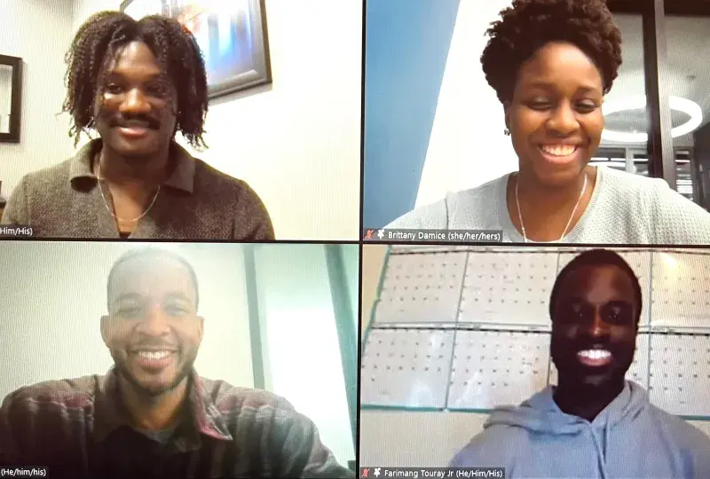 4 people in a Zoom photo