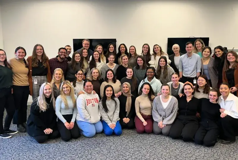 students pose and smile