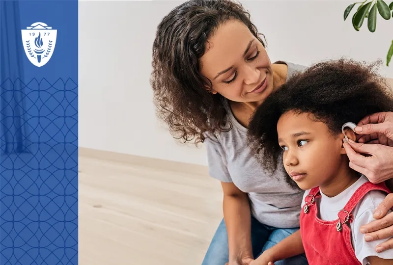 woman has arm around her daughter who is getting fitted for a hearing aid