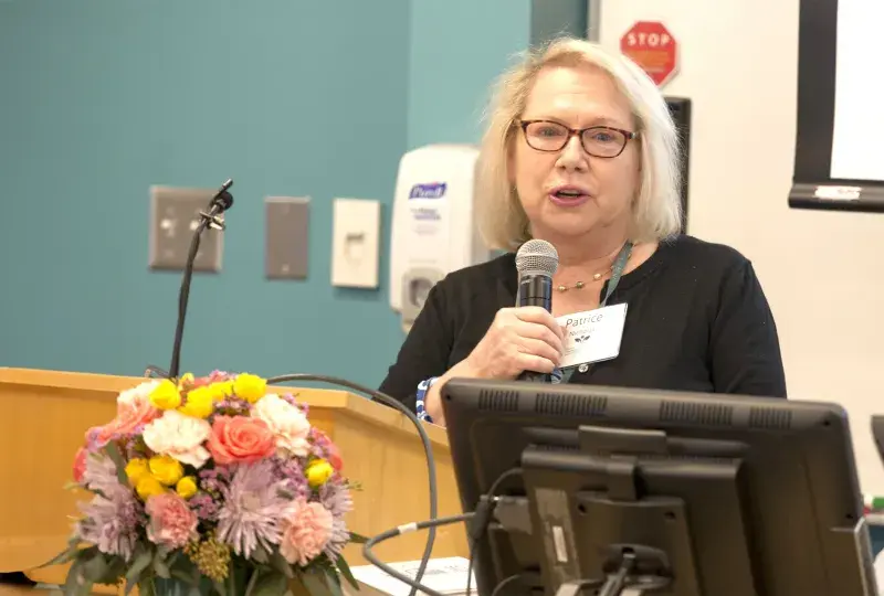 woman speaking at podium