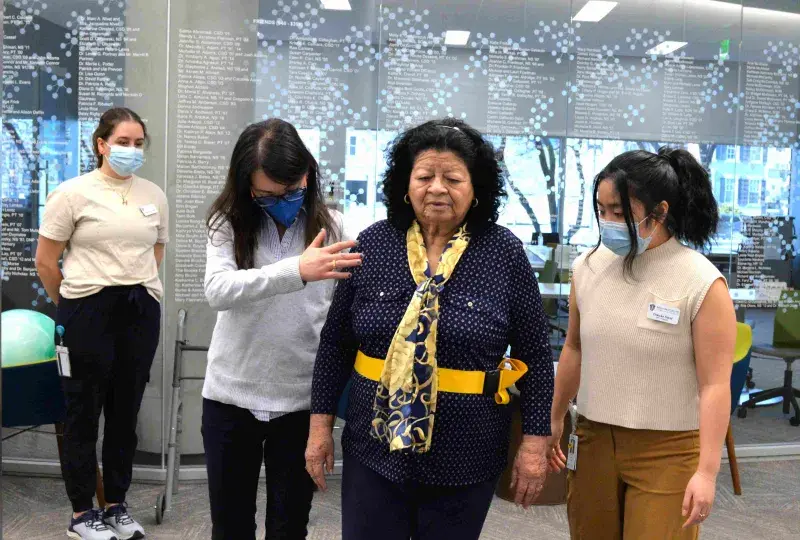 Students assisting a client