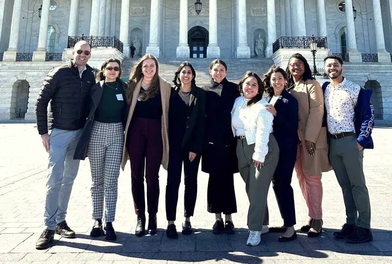 People standing in front of the US Capitol