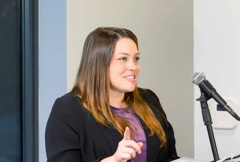 Woman speaking at podium