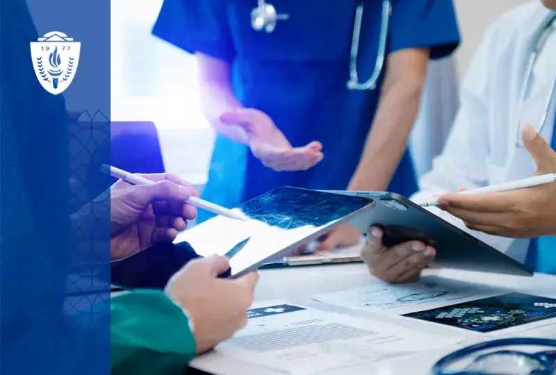 closeup of hands using tablets, the people are wearing lab coats and stethoscopes
