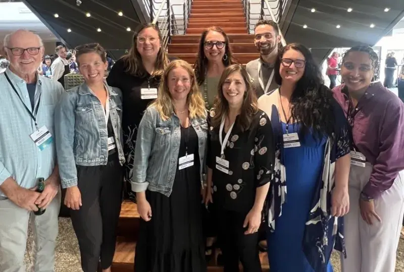 SAiL lab members pose in front of staircase.