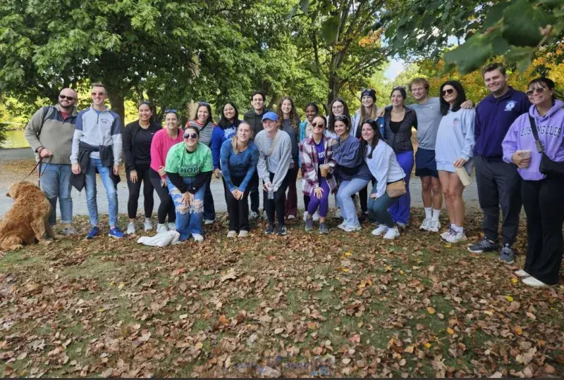 group photo in front of trees