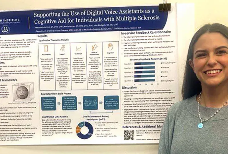 A woman stands in front of a poster at a research conference