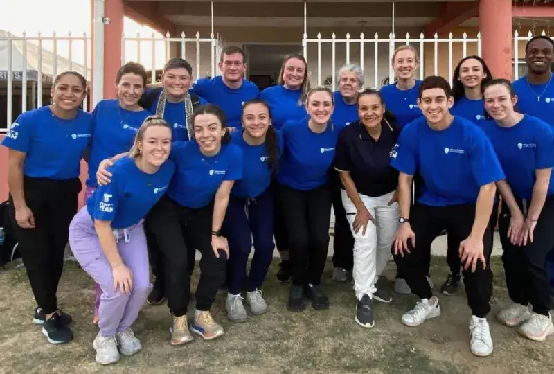 group of students posing outside of Guatemalan clinic 