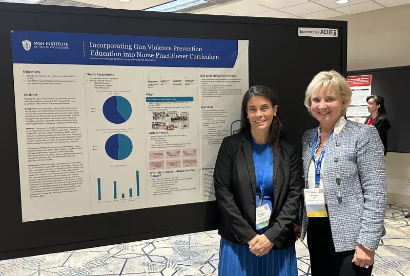 two men nxt to poster