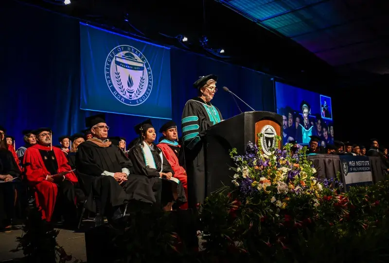 woman at commencement podium