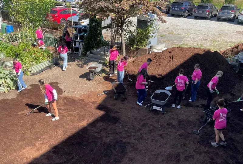 student volunteering at urban farm 