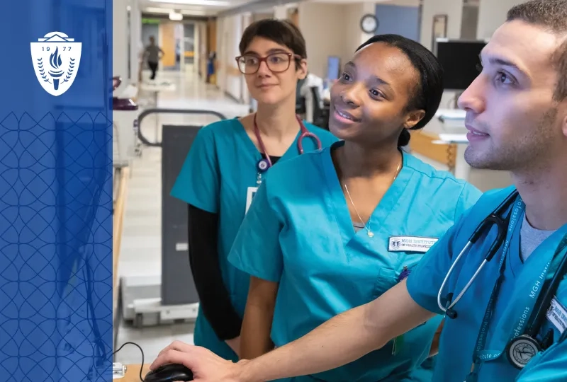 Healthcare Workers wearing scrubs and stethoscopes looking at computer screen