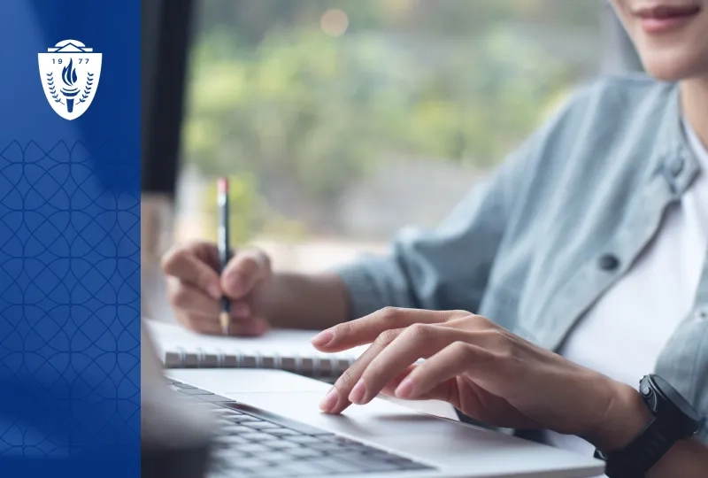 woman shows how to write a graduate program application essay on a laptop