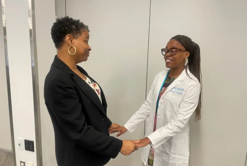 mom and daughter holding hands 