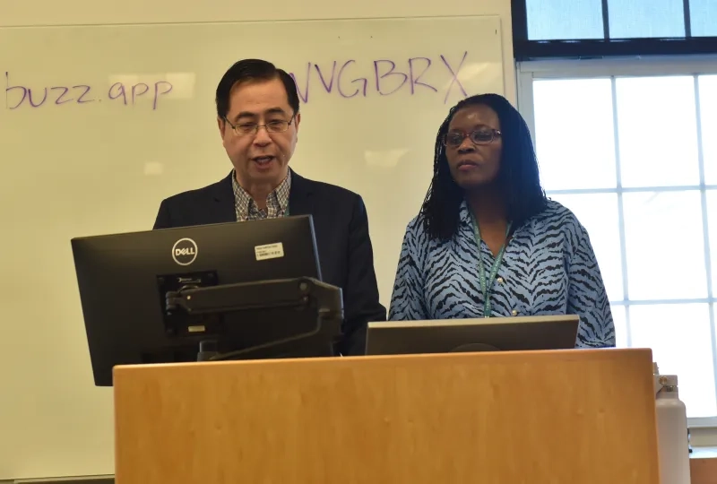 man and woman at podium 