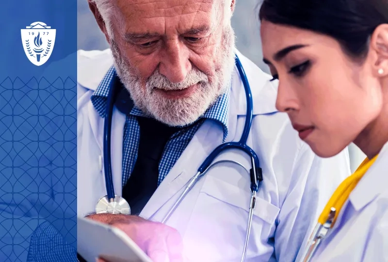 A physician educator works one-on-one with a resident physician while reviewing a digital learning platform on a tablet in a teaching hospital conference room. The image should emphasize coaching, conversation, mentorship, and collaborative learning rather than technology alone. 