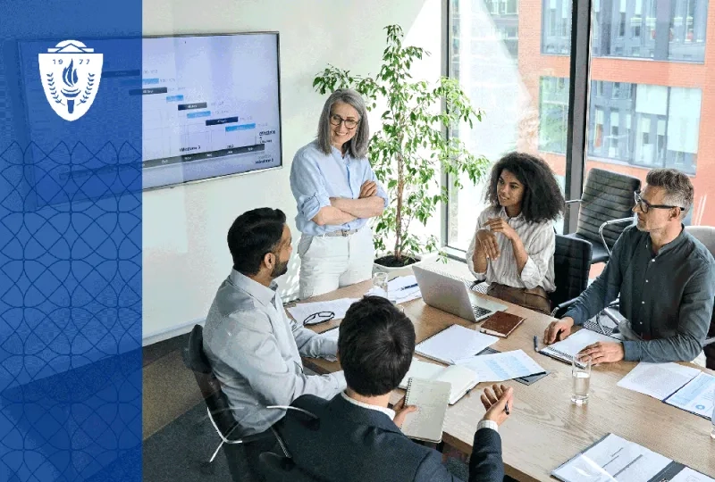 Faculty leaders from multiple health professions sit around a conference table discussing curriculum planning with dashboards, laptops, and educational materials visible. The environment should feel collaborative, strategic, and grounded in academic leadership. 