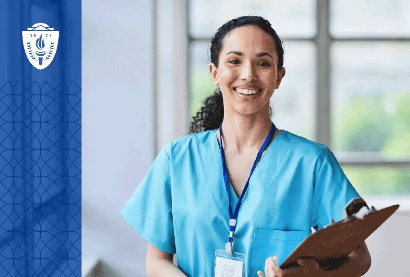Nurse holding a clipboard, wearing blue scrubs, and wearing a lanyard around her neck