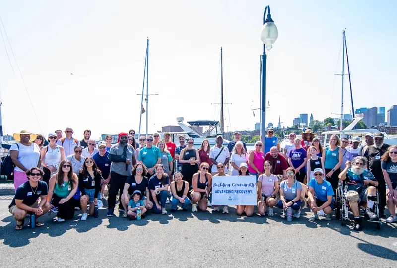 A group photo of stroke survivors, care partners, students, faculty, staff, and community partners after the Waterfront Wellness Walk