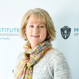 Headshot of a faculty member in the MGH IHP Doctor of Physical Therapy program with the institute's branding in the background