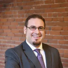 Aaron Hoffman in grey suit and purple tie