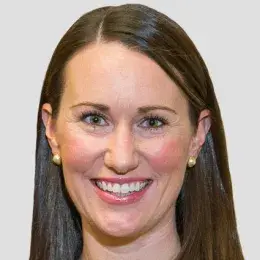 Professional headshot of an MGH IHP Doctor of Speech-Language Pathology program faculty member with a studio background.
