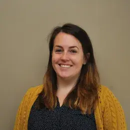 Lisa Quinn in yellow sweater