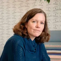 Courtney Hernandez in blue shirt