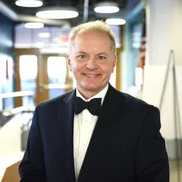 Alex Hoyt in blazer and bowtie